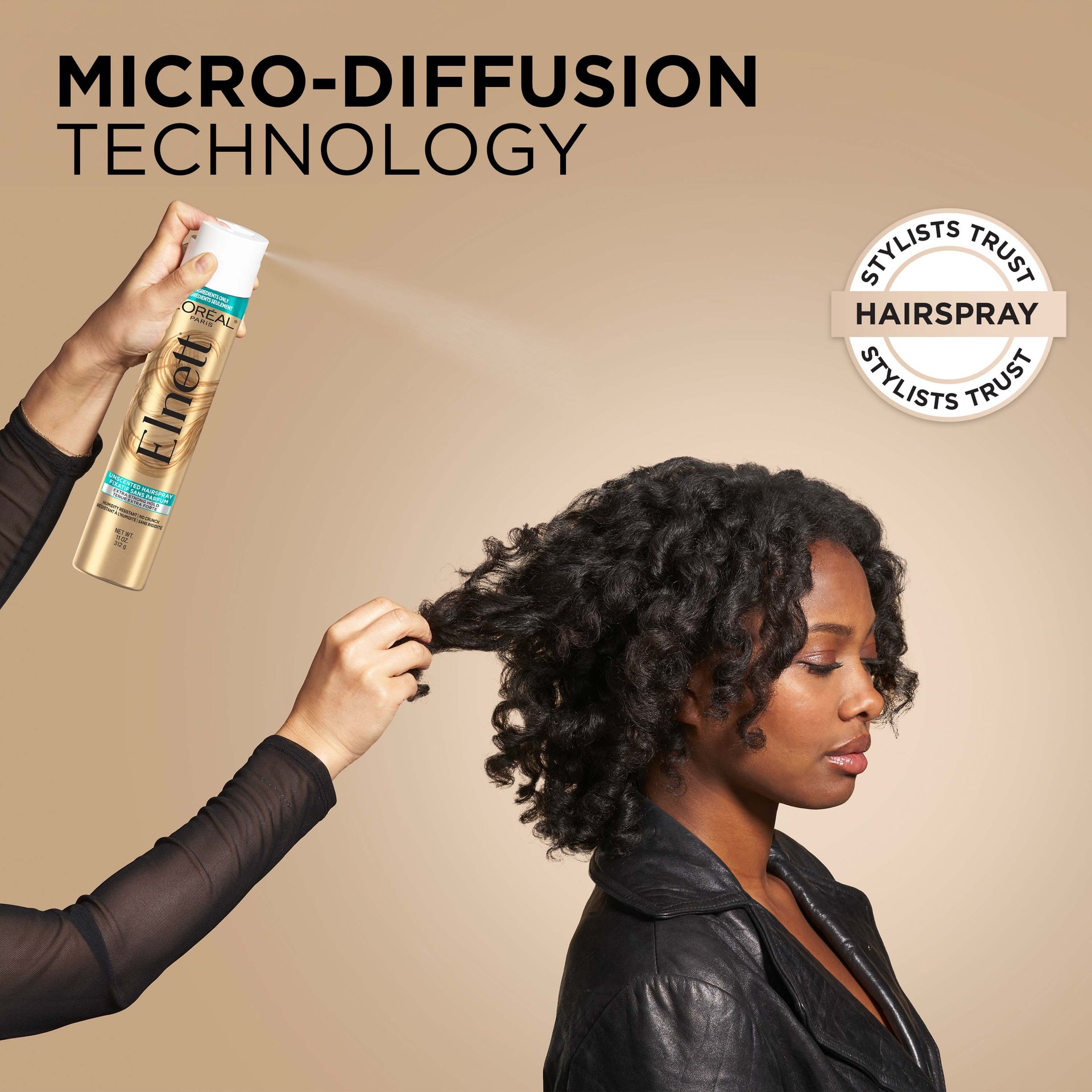 a woman is doing hair care routine and spraying elnett hair spray to fix the blowout